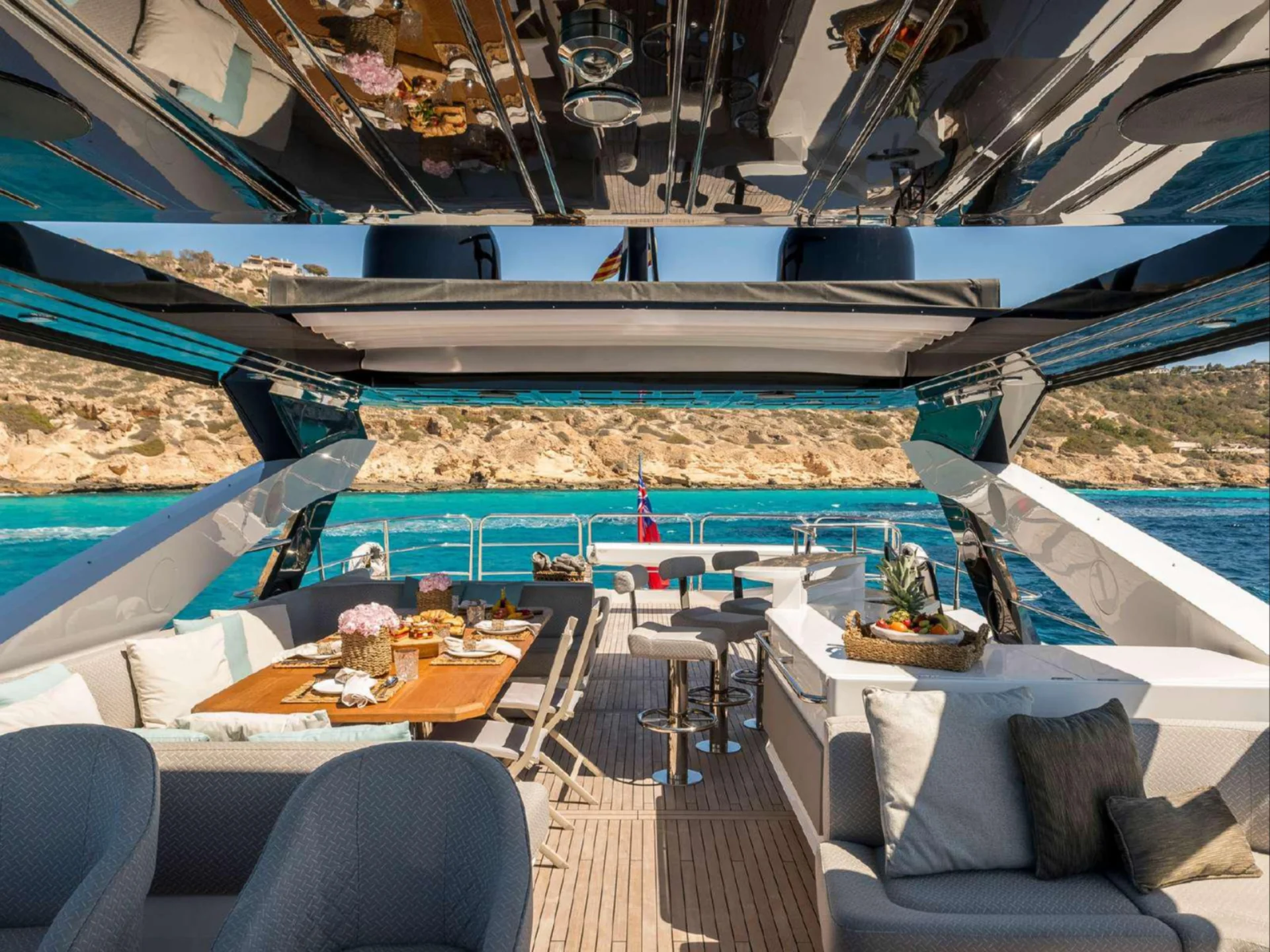 Flybridge of SEAWATER II with sunpads and the helm